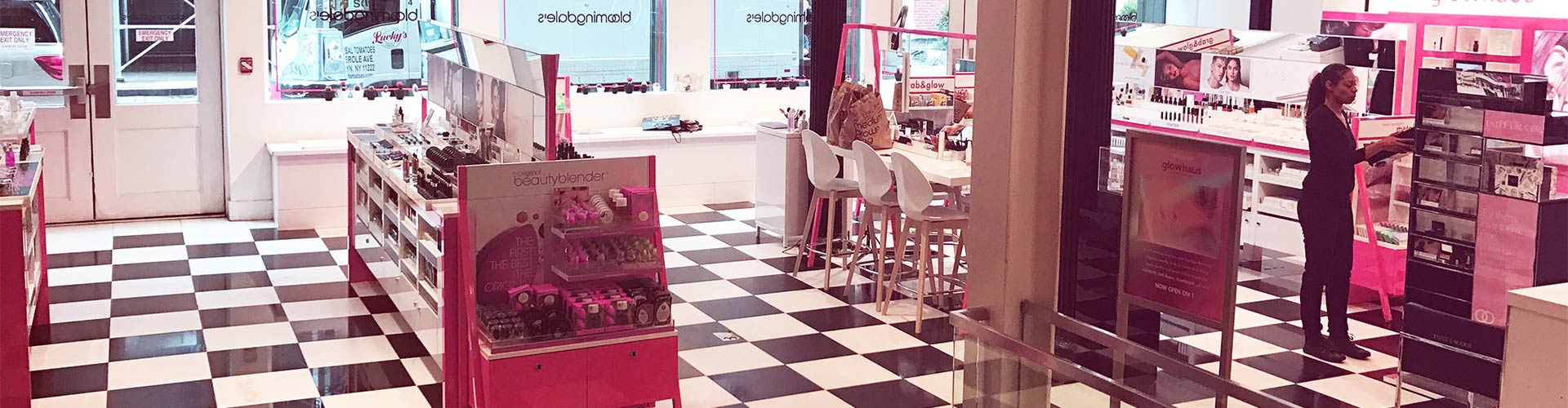 Blog banner featuring inside of a Bloomingdales with worker tending to the displays
