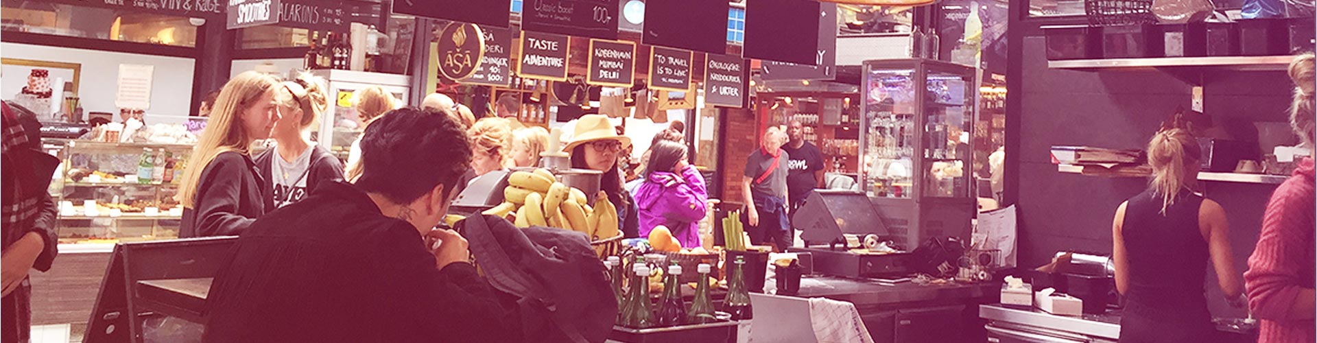 Blog banner featuring market cafe and shoppers busily moving around