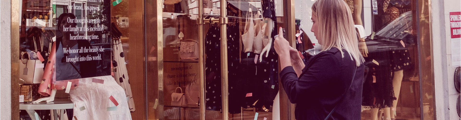 Blog banner featuring woman looking into Kate Spade store window