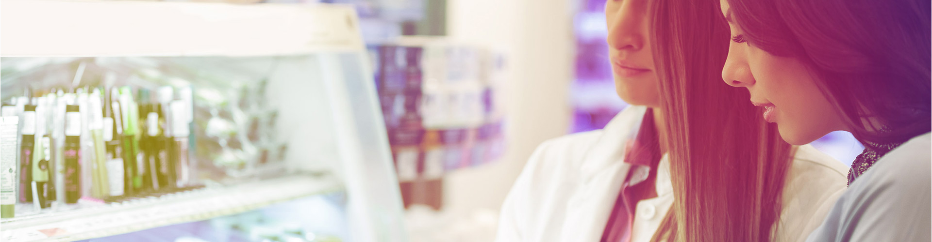 Blog banner featuring pharmacist and customer looking at shelves