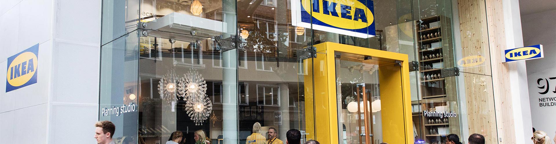 Blog banner featuring busy storefront entrance to an IKEA