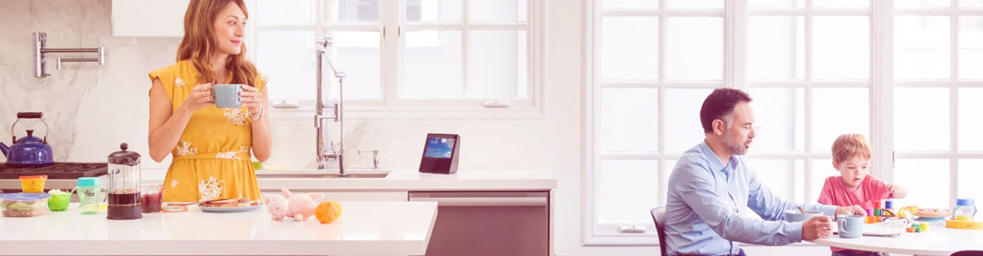 Blog banner featuring family at home with voice activated device on kitchen counter