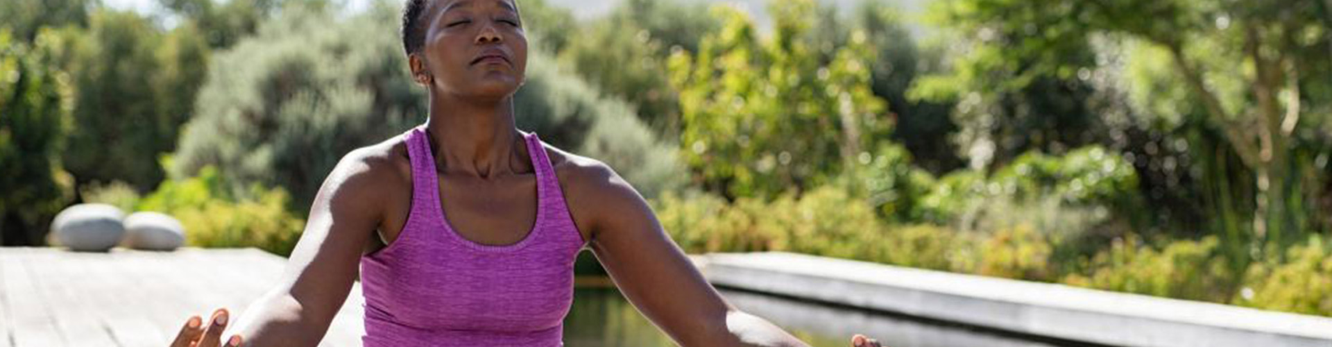 Through the Retail Industry Lens: Consumers and Wellness blog banner featuring young black woman meditating outside