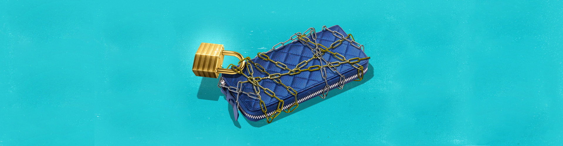 Teal background with blue satin wallet wrapped in gold chain and lock - banner