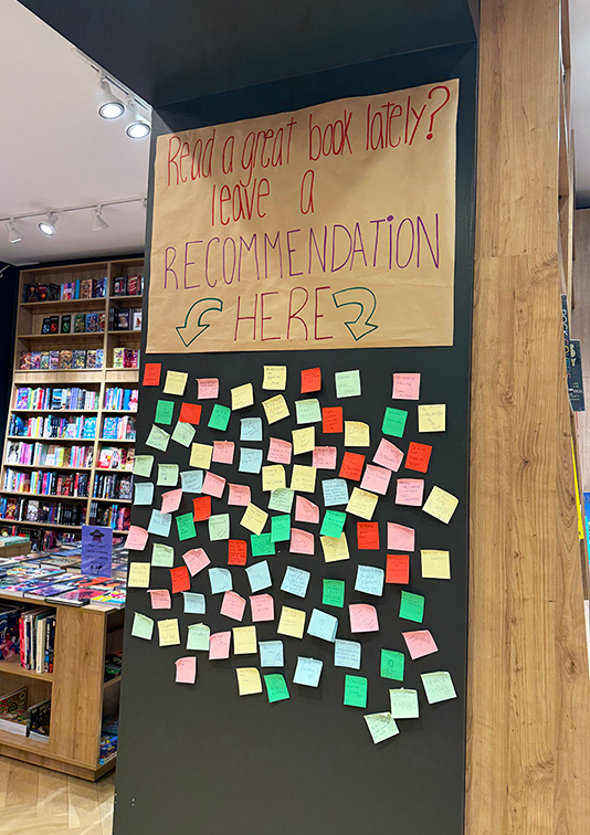 WSL Top Innovator featuring Quade Books' community book recommendation sticky note board