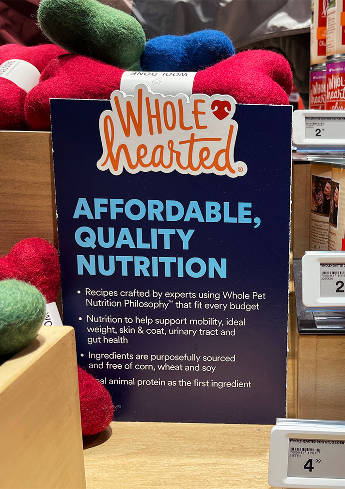 Top Innovation photo of Petco's signage about Wholehearted brand food's benefits