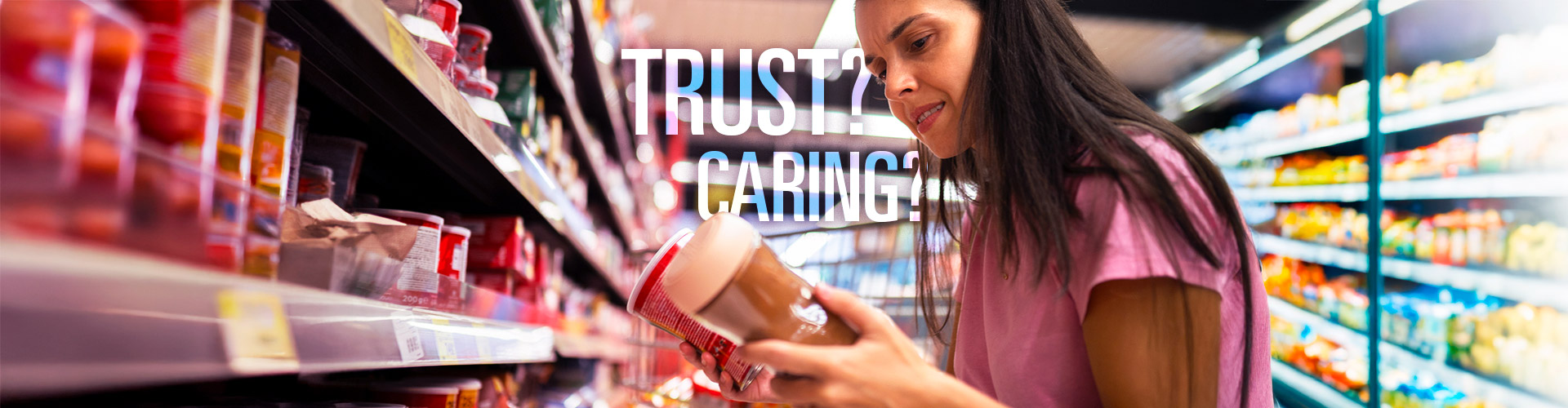 Blog banner featuring middle aged woman comparing food products from grocery shelf, words Trust? and Caring? overlaid behind her