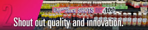 "Shout out quality and innovation" header banner, with Trader Joe's informational signage on their organic juice shots as background image